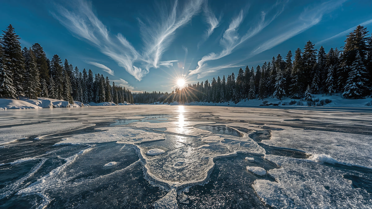 photo-wallpaper-frozen-lake-with-sunburst-over-snowy-conifer-forest