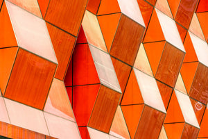 photo-wallpaper-orange-diamond-panels-forming-a-geometric-facade-pattern