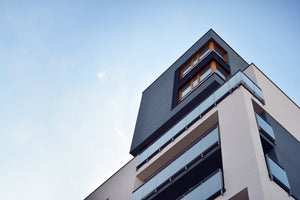 photo-wallpaper-building-corner-with-glass-balconies-against-a-clear-blue-sky