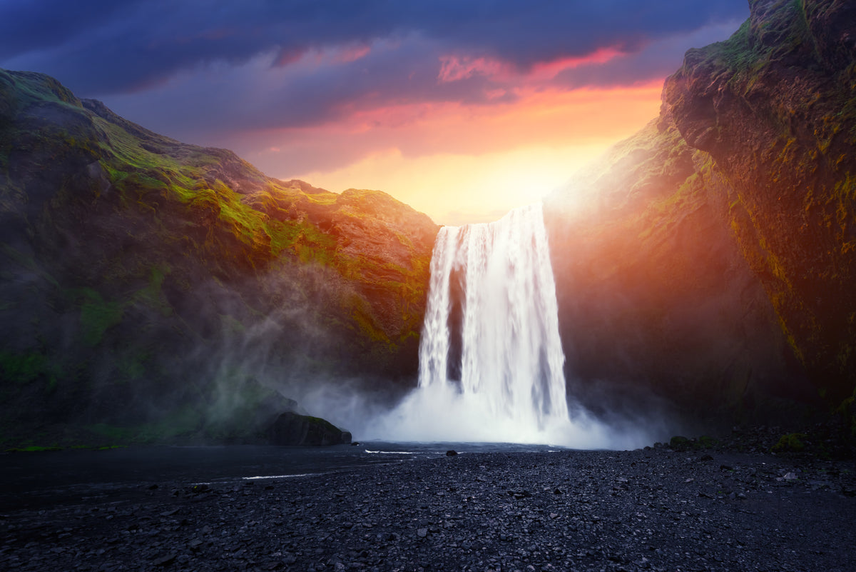 photo-wallpaper-skogafoss-glowing-at-sunset-icelands-thundering-waterfall