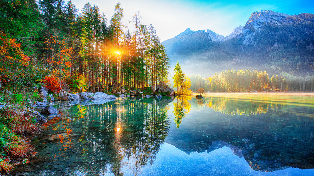 photo-wallpaper-turquoise-mountain-lake-in-autumn-with-sunburst-through-conifers