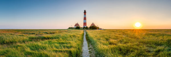 photo-wallpaper-westerheversand-lighthouse-above-salt-marshes-at-sunset