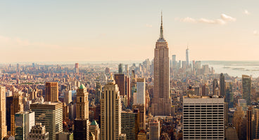 photo-wallpaper-empire-state-building-above-the-manhattan-skyline-in-warm-evening-light