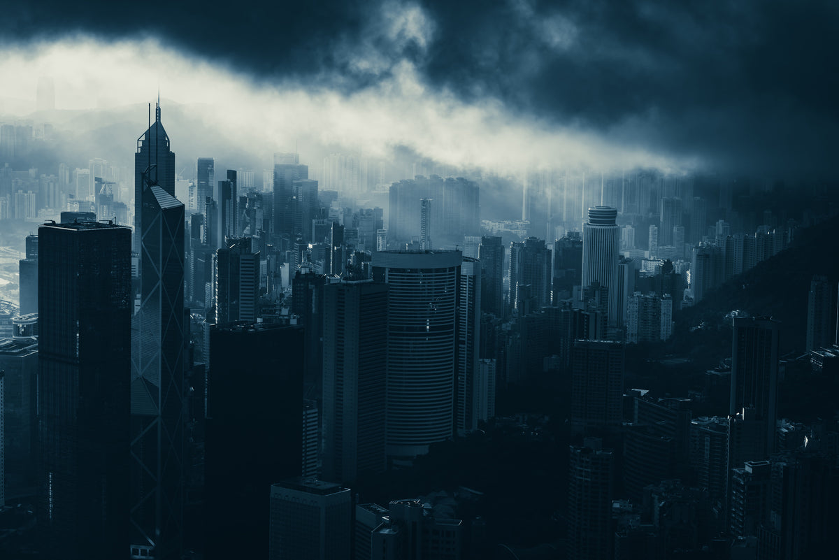 photo-wallpaper-hong-kong-skyline-beneath-heavy-storm-clouds-in-cool-blue