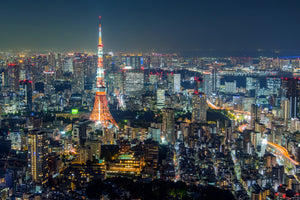 photo-wallpaper-tokyo-tower-glowing-above-a-sea-of-city-lights-at-night