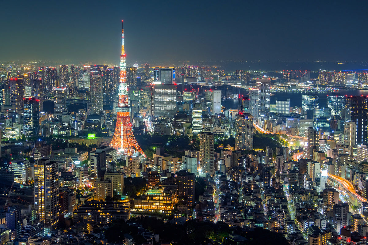 photo-wallpaper-tokyo-tower-glowing-above-a-sea-of-city-lights-at-night