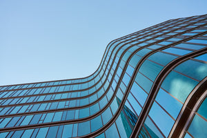 photo-wallpaper-curving-glass-facade-in-blue-seen-from-below