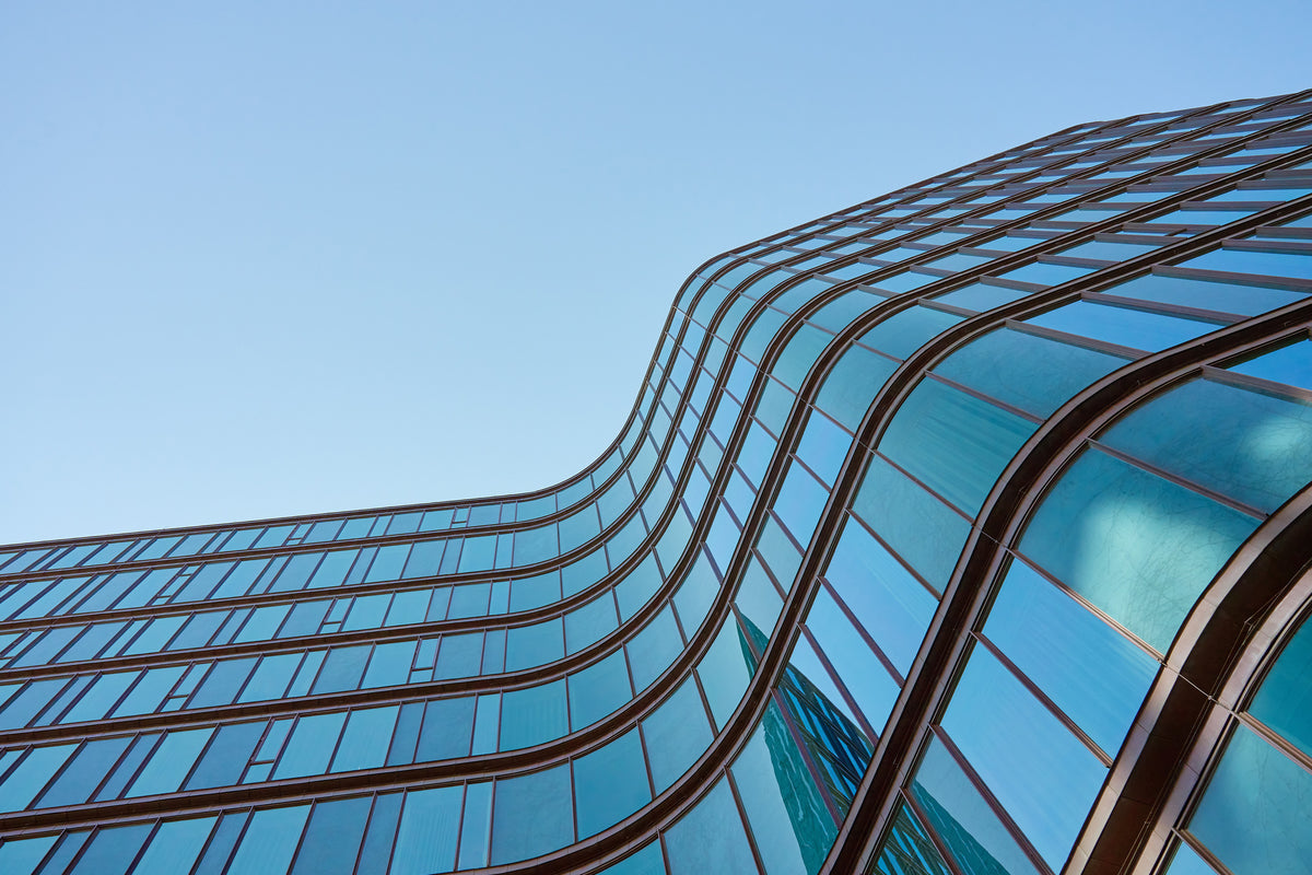 photo-wallpaper-curving-glass-facade-in-blue-seen-from-below