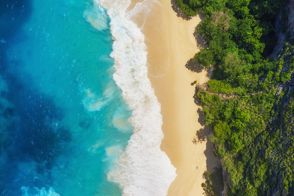 photo-wallpaper-turquoise-surf-on-a-sandy-beach-with-lush-tropical-coastline-from-above