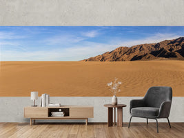 photo-wallpaper-rippled-desert-sand-beneath-a-bare-mountain-ridge