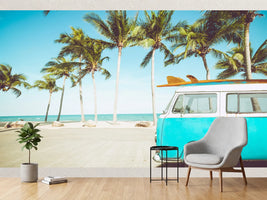 photo-wallpaper-turquoise-camper-van-with-surfboard-on-a-palm-lined-beach-in-retro-summer-light