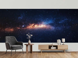 photo-wallpaper-glowing-galaxy-band-in-amber-and-deep-blue-among-countless-stars