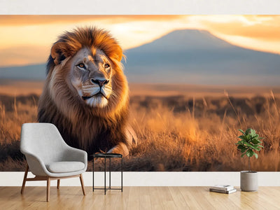 photo-wallpaper-lion-in-the-savannah-at-golden-hour-with-a-mountain-on-the-horizon