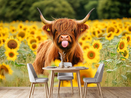 photo-wallpaper-a-highland-cow-with-huge-horns-standing-in-a-sunflowers-field
