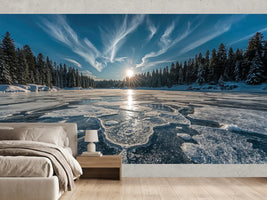 photo-wallpaper-frozen-lake-with-sunburst-over-snowy-conifer-forest