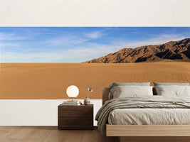 photo-wallpaper-rippled-desert-sand-beneath-a-bare-mountain-ridge